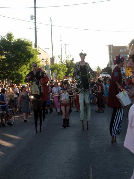 you can't really call a few people in stilts and drag a parade, but they were all singing the same song... seemed like they even knew the same words, too!